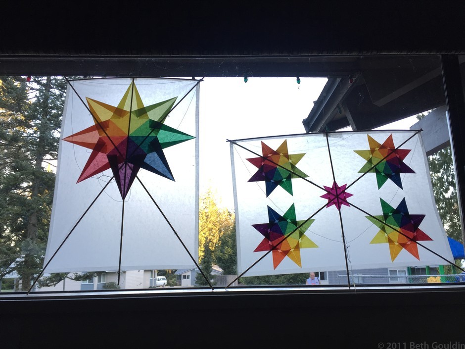Two kites backlit in the classroom